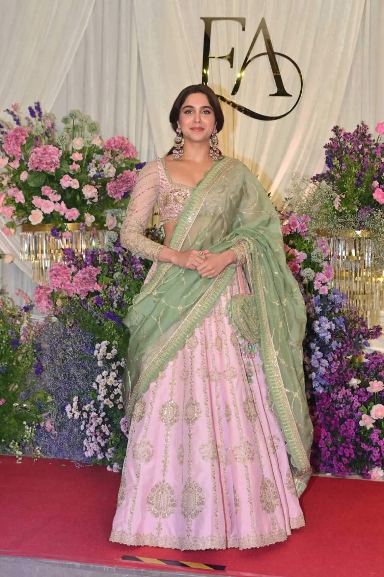<p><span class="hover:entity-accent entity-underline inline cursor-pointer align-baseline"><span class="whitespace-normal">Sharvari Wagh</span></span> looked stunning in a pink lehenga paired with a contrasting green dupatta. The outfit featured intricate golden embellishments that added a festive sparkle to her look.&nbsp;</p>